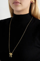 elongated bow NECKLACE